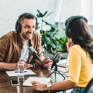 Two people recording a podcast