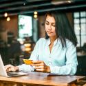 Student with credit card and laptop